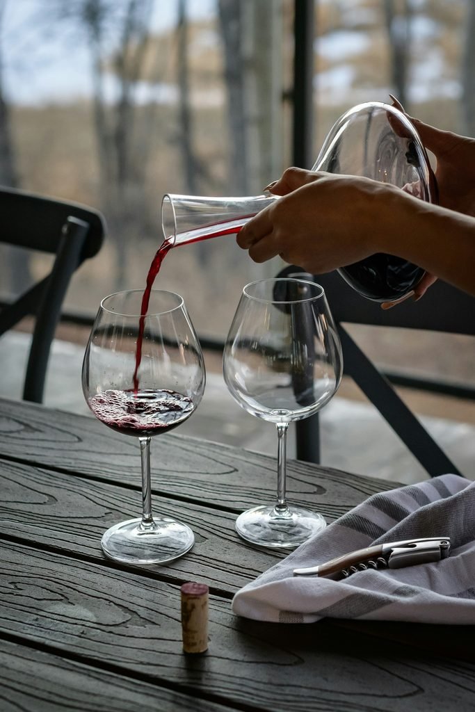 Red Rioja being poured from a wide-based decanter